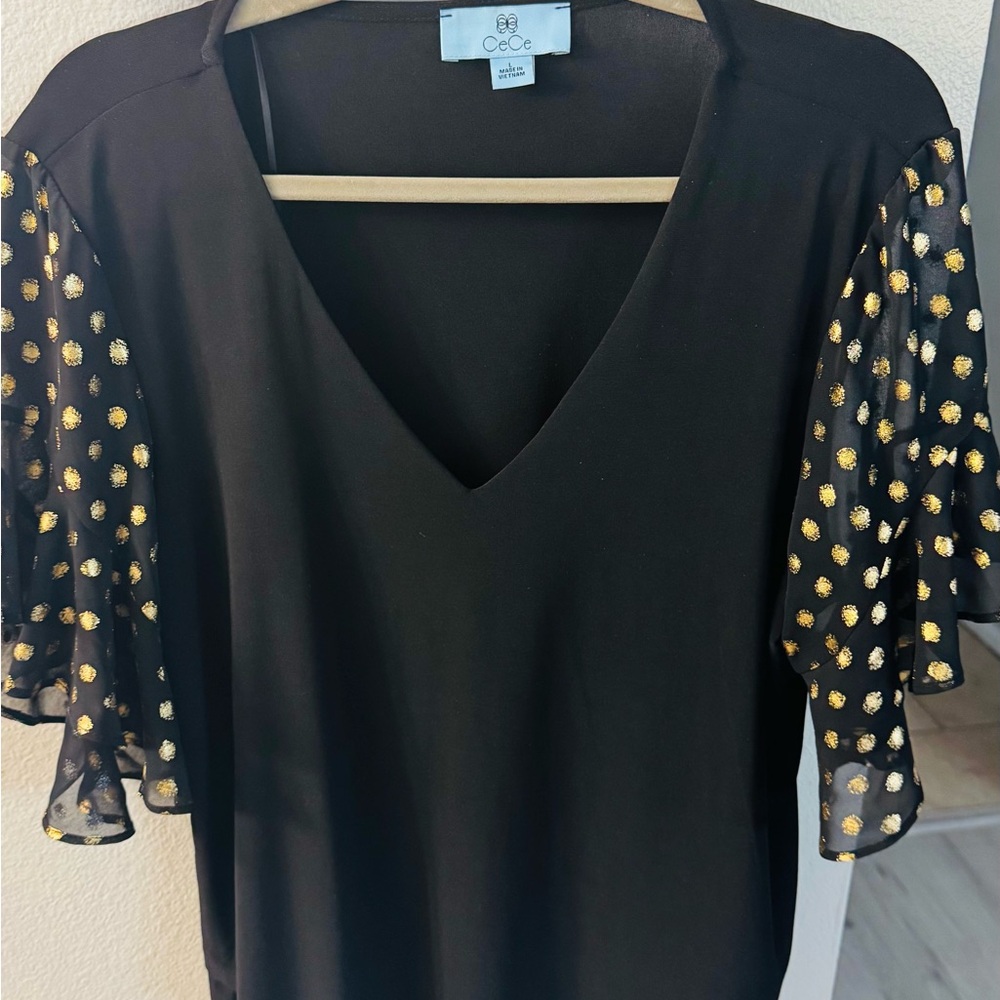 CeCe Black Blouse  with Gold Accents on the sleeves.